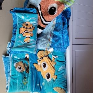 Disney Find Nemo crib bedding set with rug and diaper holder.